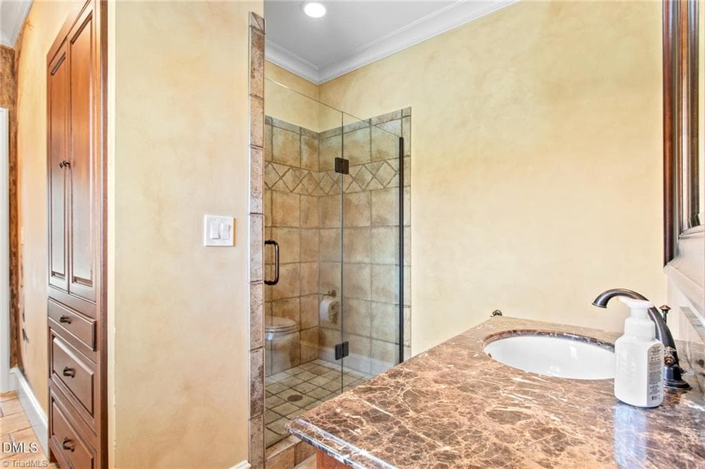 Jack-n-jill bath with built-in shelving and cabinets - 841 Dunleigh Drive, Burlington NC 27215, Burlington