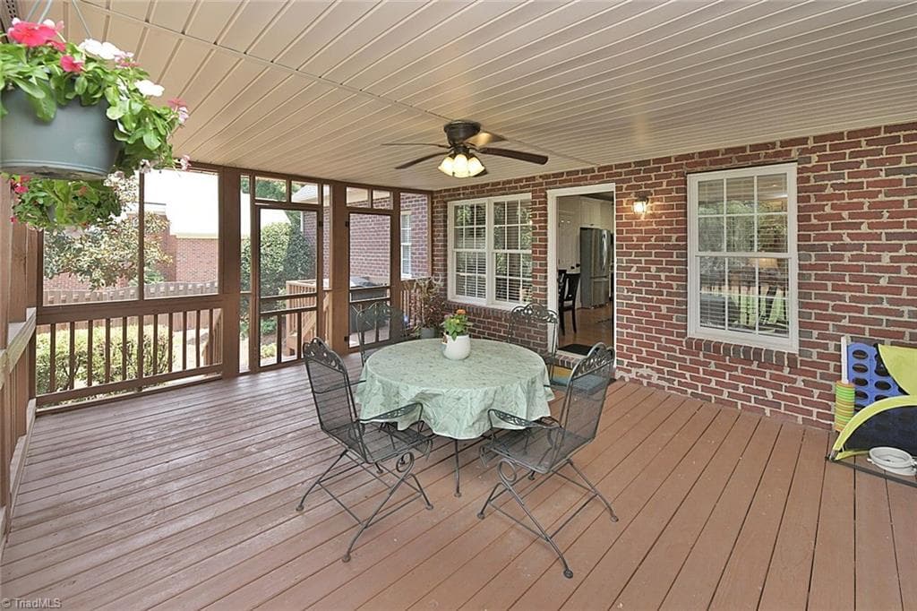 Welcome to your private retreat, featuring an oversized screened porch and attached grilling deck located just off the family and breakfast rooms—the perfect setting for morning coffee or hosting memorable gatherings. - 1101 Clyde Edgerton Drive, Kernersville NC 27284, Kernersville