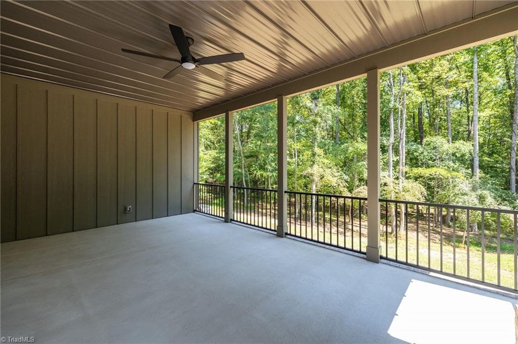 Covered back porch overlooking the private wooded lot. - 568 N Bunker Hill Road, Oak Ridge NC 27310, Oak Ridge