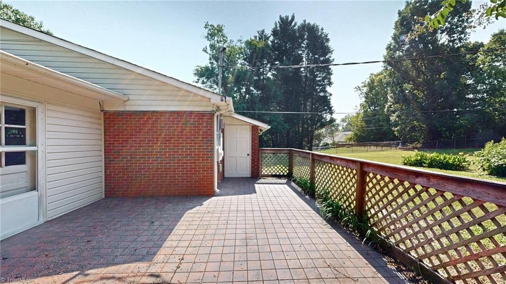 Nice patio area and note the utility room which hold the Brand-New Hot Water heater. - 1804 Ramsey Road, Kernersville NC 27284, Kernersville