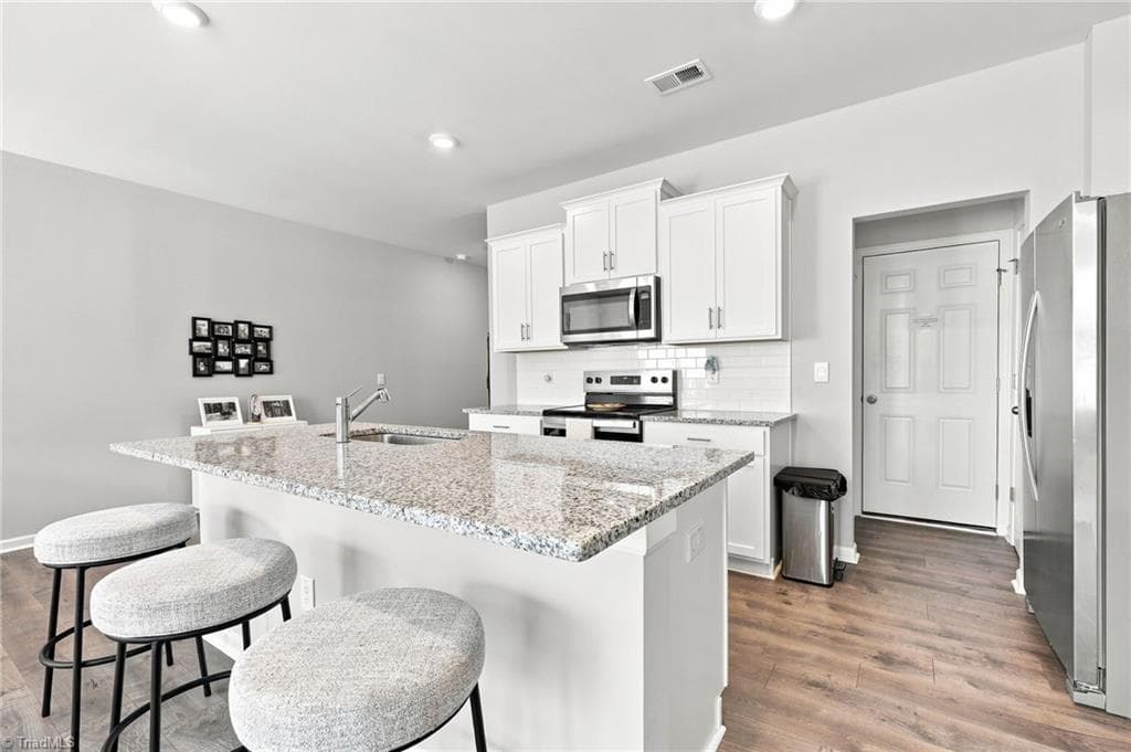 Kitchen island with space for barstools - 1262 Evelynnview Lane, Kernersville NC 27284, Kernersville