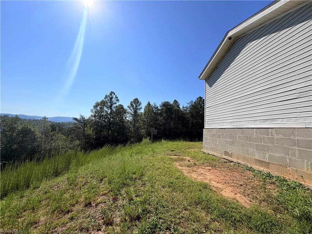 Manufactured Home at 1490 Glenn Carlton Road, Boomer NC 28606, photo 6 of 23