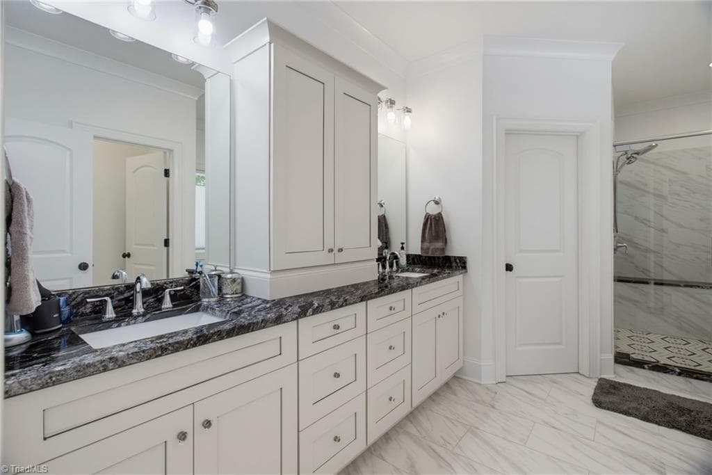 Spacious spa-like primary bathroom with double sinks, free standing tub, shower and plenty of storage - 428 Wentworth Drive, Winston-Salem NC 27107, Winston-Salem