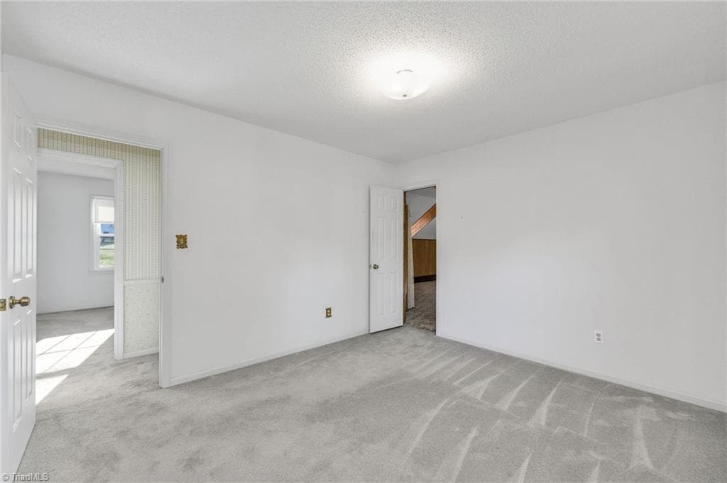 3rd Bedroom with entrance to Bonus Room (back center) - 196 Lewis Fork Drive, Wilkesboro NC 28697, Wilkesboro