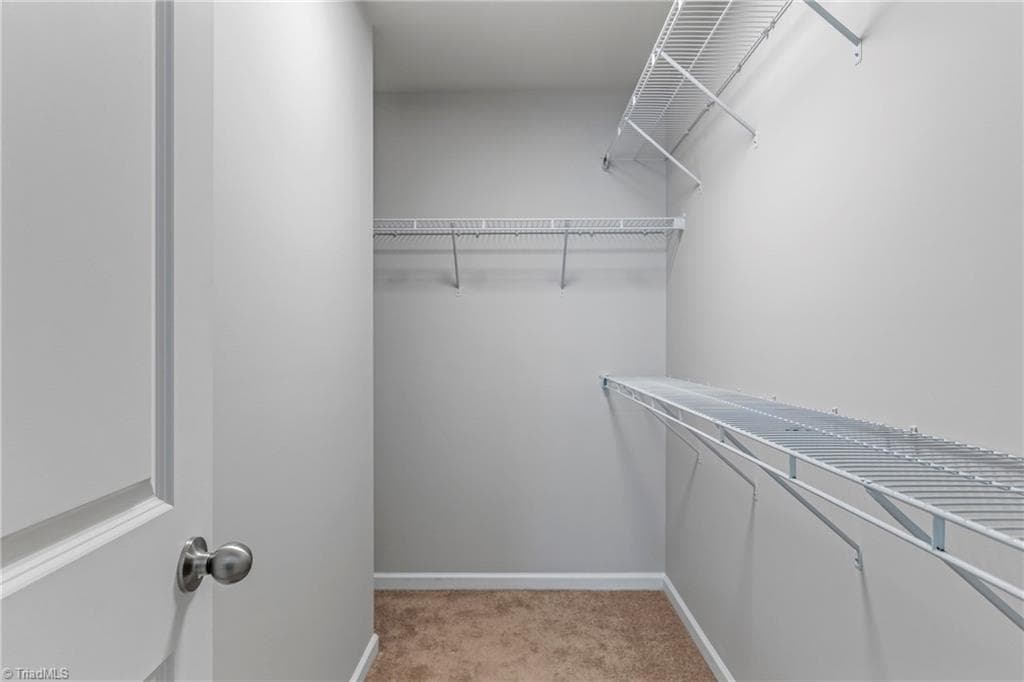 Large l- shaped primary closet - 104 Tanner Grove Court, Kernersville NC 27284, Kernersville