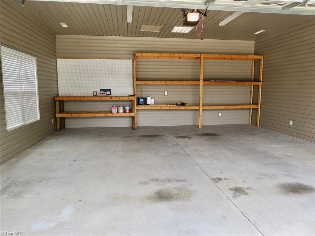Workbench and shelves in detached garage - 132 Feather Ridge Circle, Reidsville NC 27320, Reidsville
