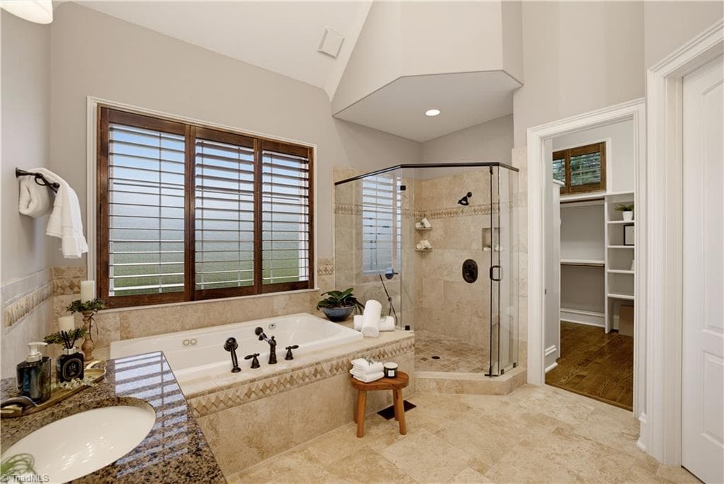 Primary bath with jetted tub, large shower and 2 separate vanities - 7404 Hadleigh Court, Oak Ridge NC 27310, Oak Ridge