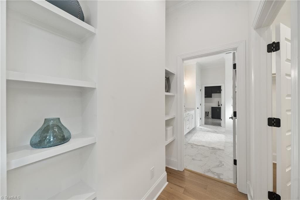 Dressing area with shelves across from the walk-in closet - 3667 Grey Oaks Court, Winston-Salem NC 27104, Winston-Salem