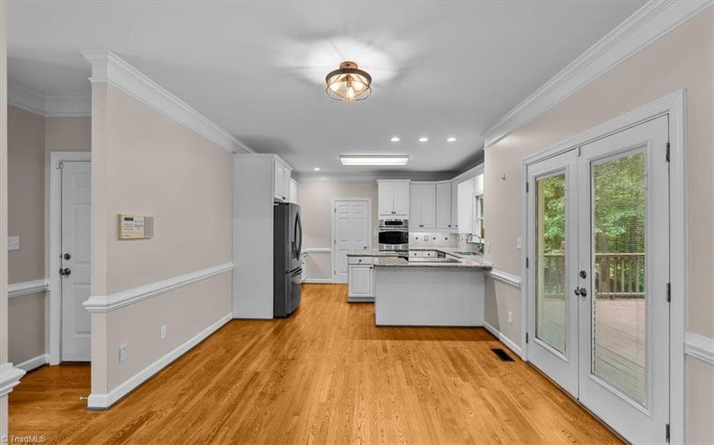 Breakfast area with entrance to back deck. - 6101 Trotter Ridge Road, Summerfield NC 27358, Summerfield