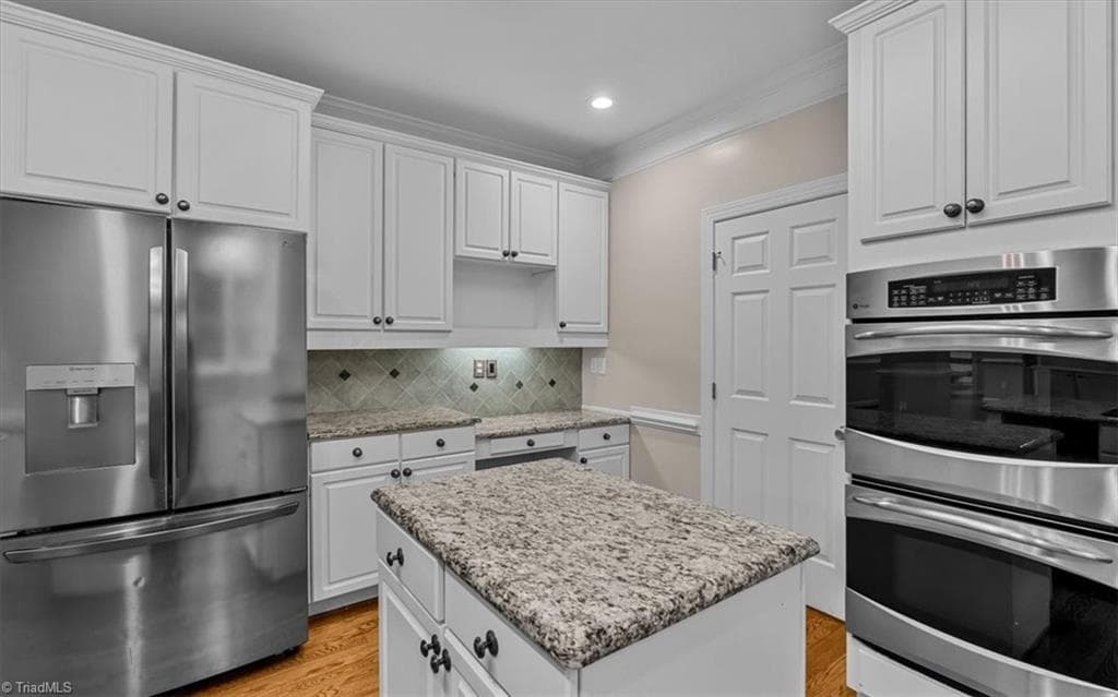 Double oven, center island, Desk area and refrigerator conveys. - 6101 Trotter Ridge Road, Summerfield NC 27358, Summerfield