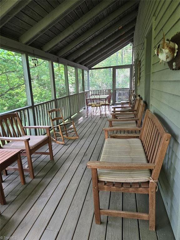 Screened porch facing the lake extends the length of the home - 1984 Horseshoe Road, Westfield NC 27053, Westfield