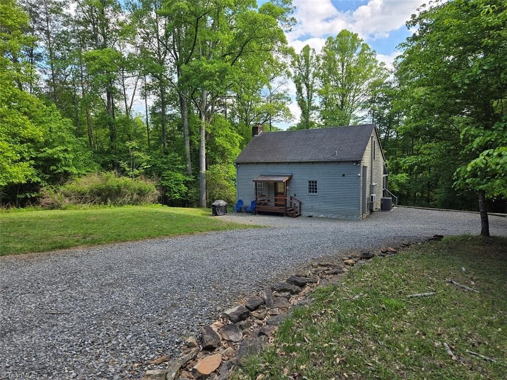 The Main Home was built in the Salt Box Style - it overlooks the lake. - 1984 Horseshoe Road, Westfield NC 27053, Westfield