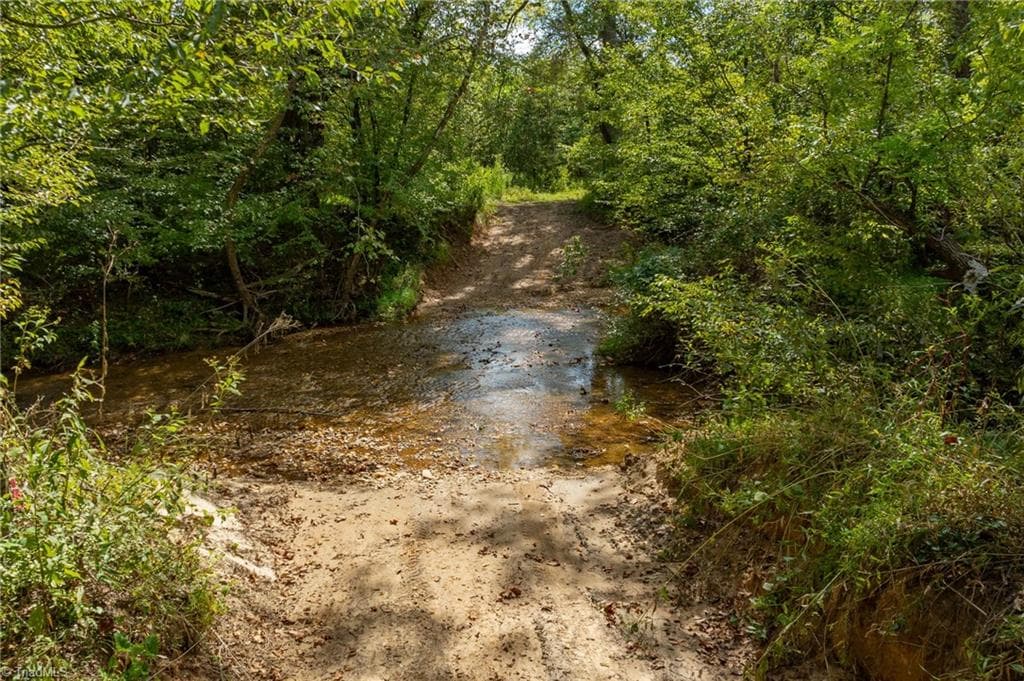 Here is access to the property. 30 foot easement off Wright Road (Private Road) provides access to the property. Wright Road is an old farm road and rugged in spots. 4 WHEELED DRIVE VEHICLE IS REQUIRED TO FORD THE CREEK AND ACCESS THE PROPERTY. - 0 Wright Road, Westfield NC 27053, Westfield