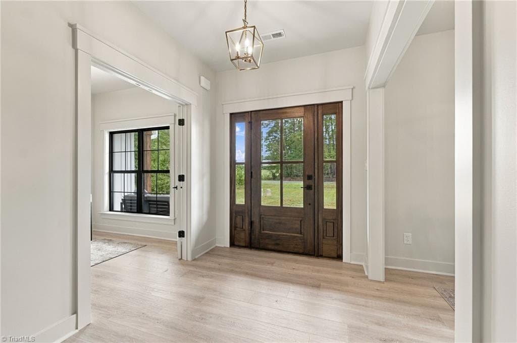 Love the spacious entry! Showstopping Custom Door - 224 Pearson Farm Road, Summerfield NC 27358, Summerfield