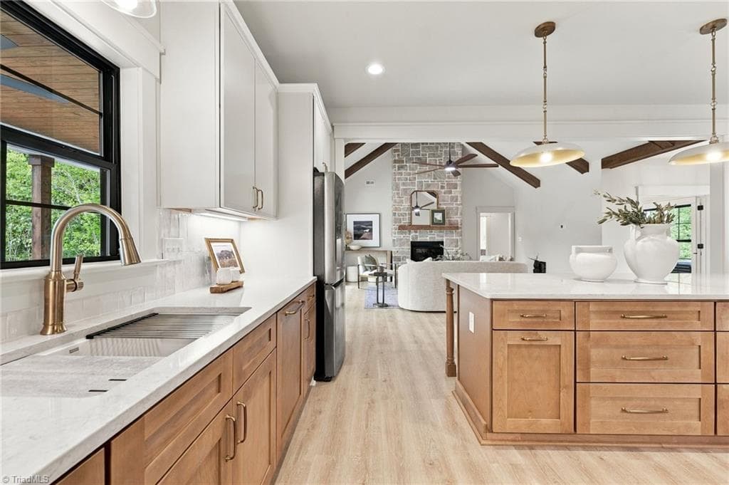 This view from the kitchen spans to the Living space for easy Entertaining! - 224 Pearson Farm Road, Summerfield NC 27358, Summerfield