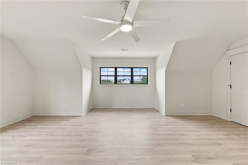 An extraordinary oversized fourth bedroom offers a world of possibilities, with abundant space to create a private guest suite, luxurious bonus living area, stylish game room, home theater, or an unforgettable entertainment retreat - 224 Pearson Farm Road, Summerfield NC 27358, Summerfield