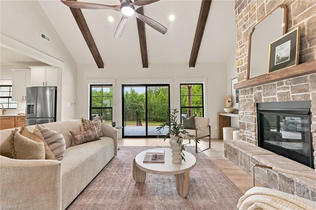 Soaring, beam-accented Living space overlooking a serene wooded backyard - 224 Pearson Farm Road, Summerfield NC 27358, Summerfield