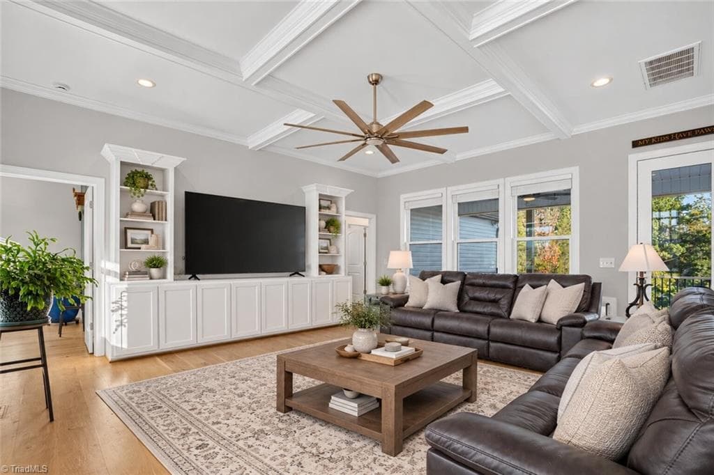 Built-ins and a ceiling fan anchor the living space - 117 Scenic View Trail, Madison NC 27025, Madison