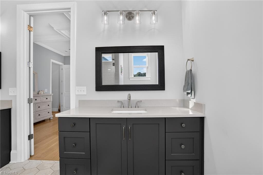 Clean-lined vanity with dark cabinetry - 117 Scenic View Trail, Madison NC 27025, Madison