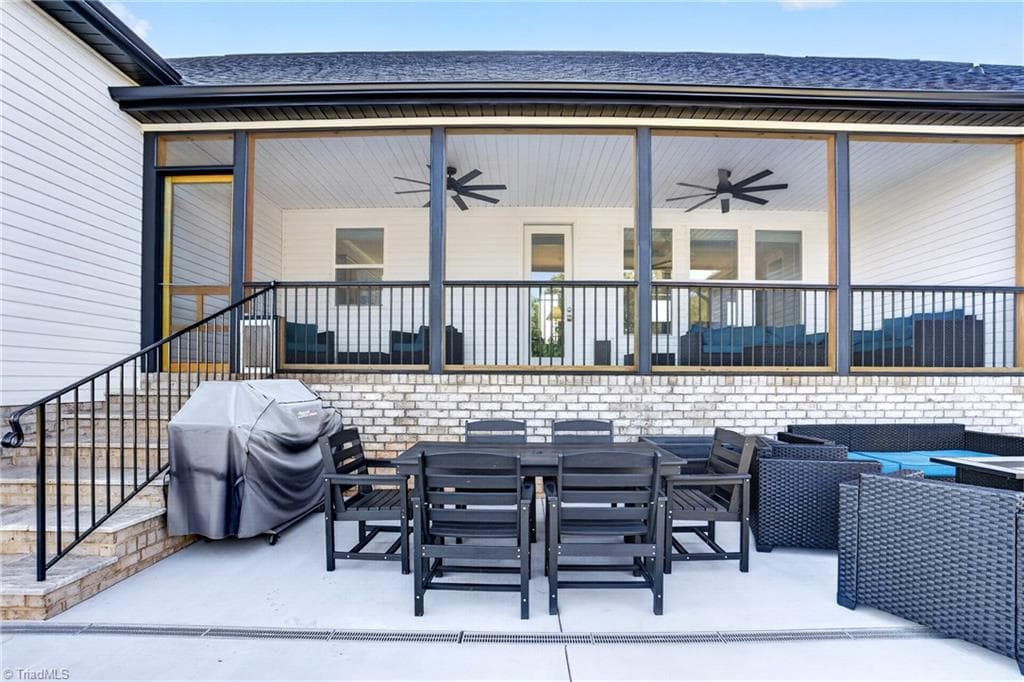 Outdoor dining under the covered porch - 117 Scenic View Trail, Madison NC 27025, Madison