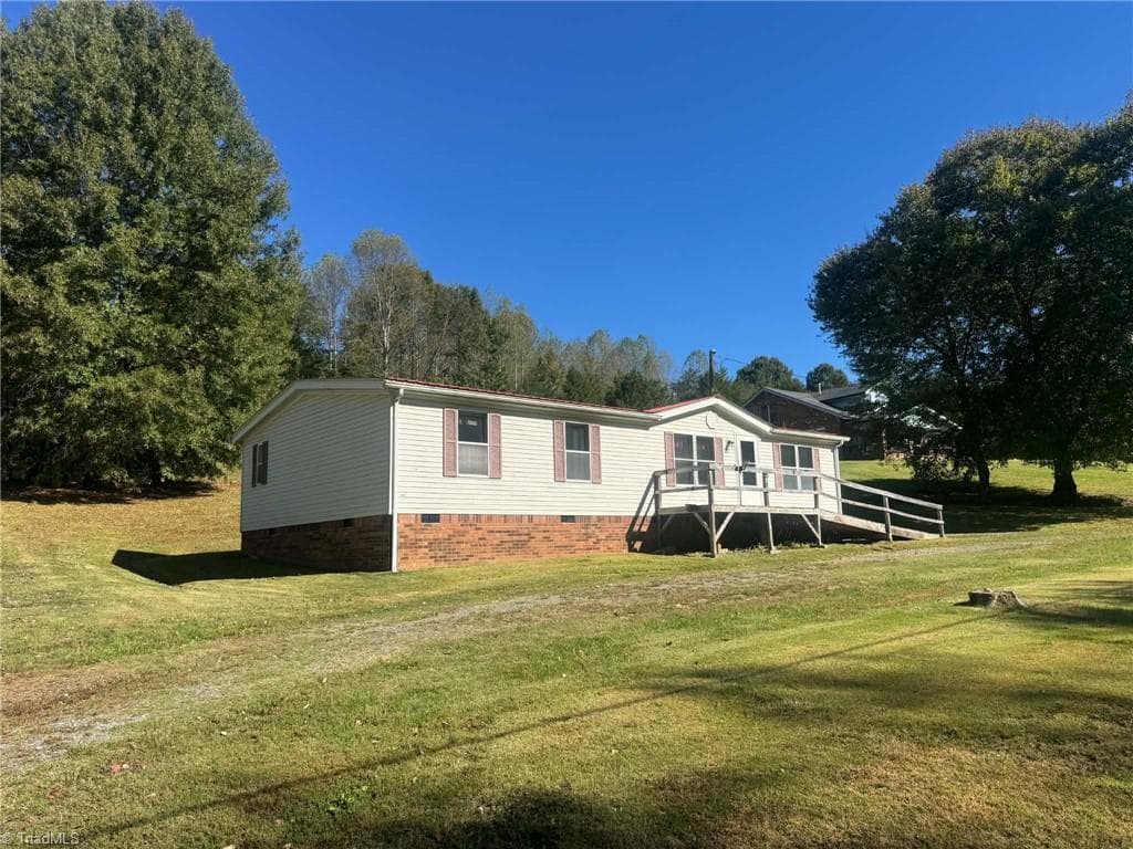 Manufactured Home at 256 Brookfall Dairy Road, Elkin NC 28621, photo 3 of 25