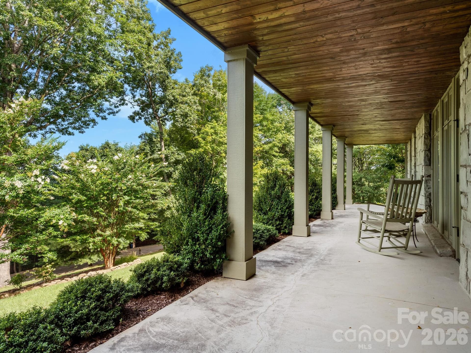 Lower-level porch with walking garden and access from living area - 65 Crestwood Road, Asheville