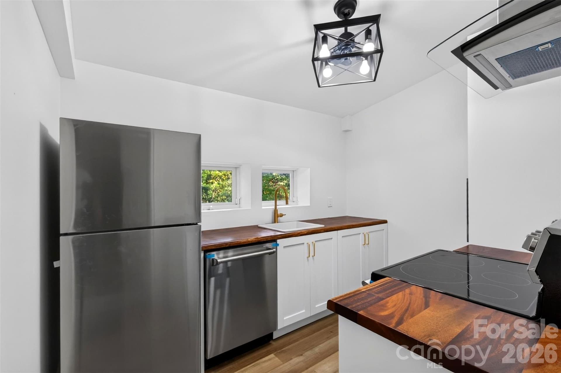 Updated kitchen with new appliances, cabinets and counter tops. - 64 and 56 Pine Cone Drive, Asheville