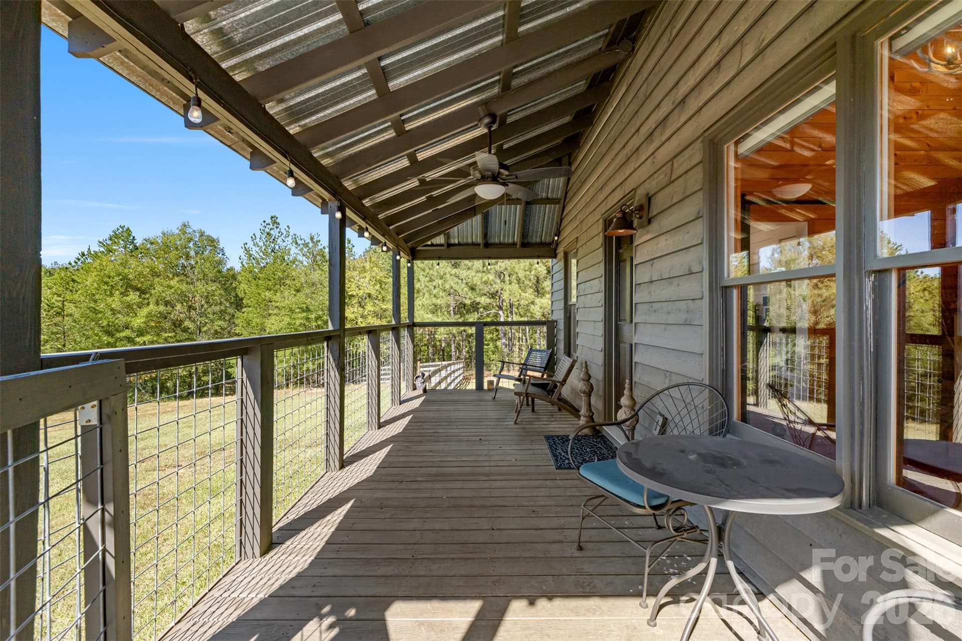 Back porch of cabin over looking the fenced pasture - 2137 Overbrook Way, Kershaw