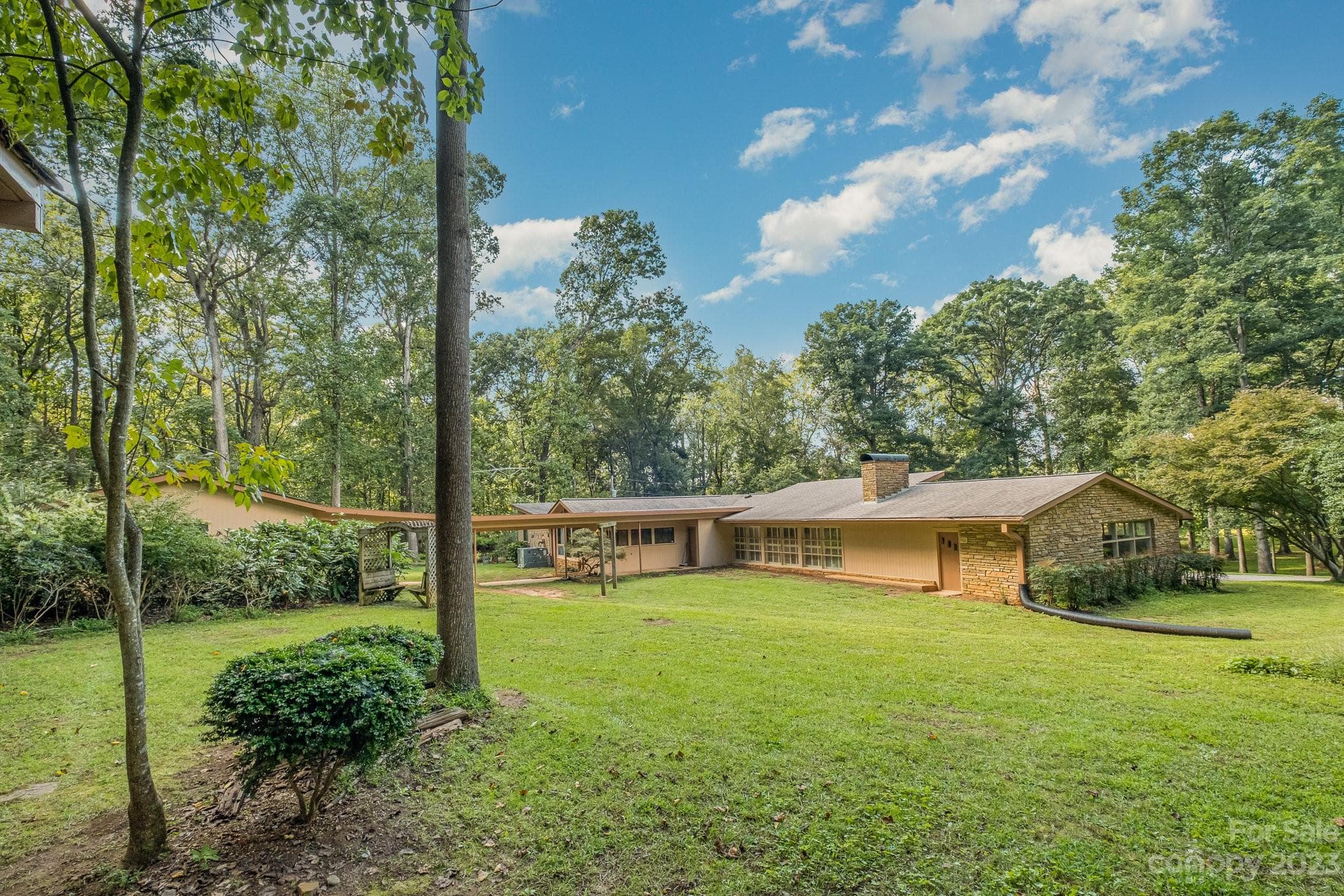 View of back of home. The door on the right leads to an extra room that could be finished behind garage. - 2756 Peachtree Road, Statesville