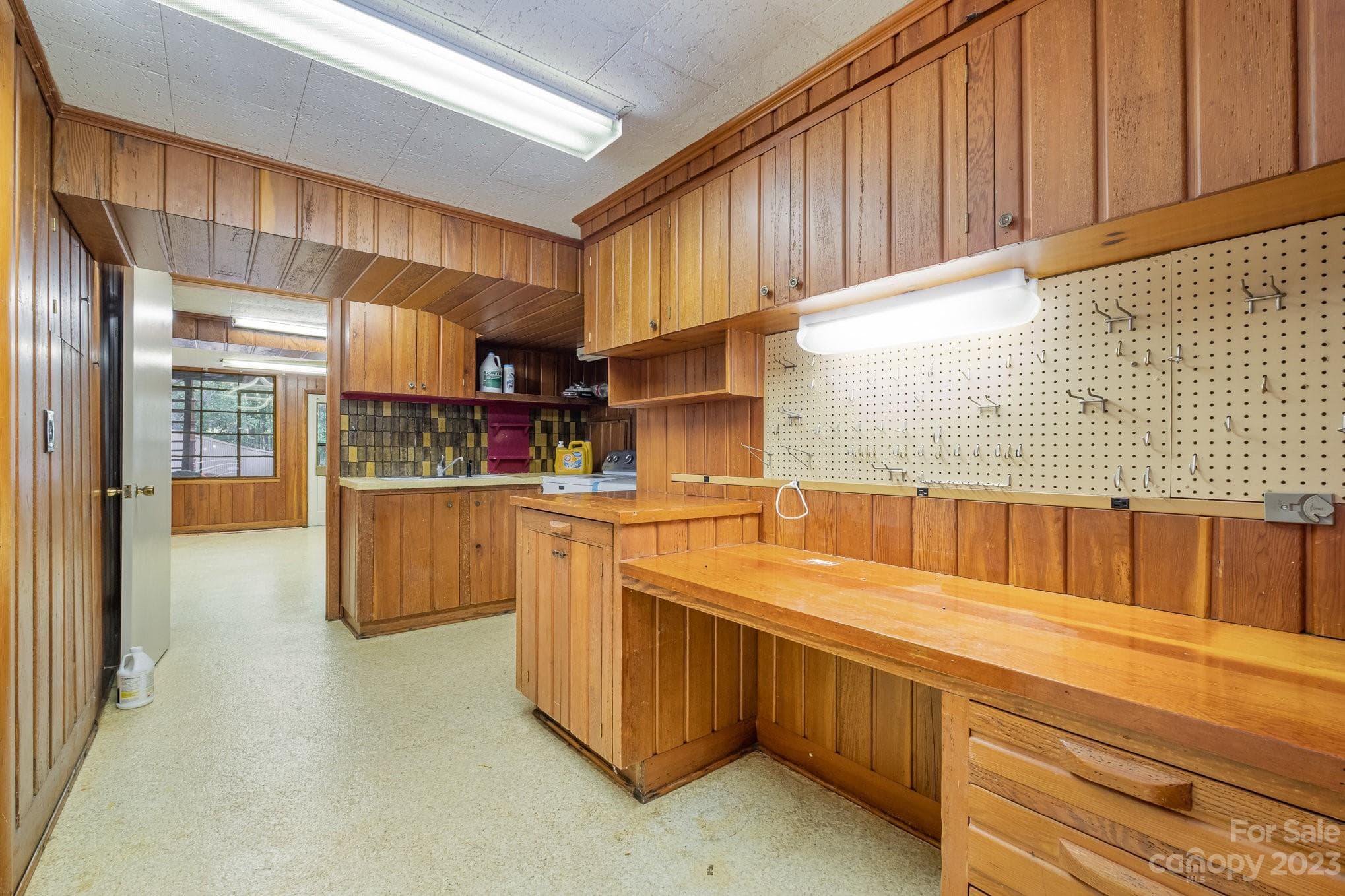 Utility area with laundry with brand new washer/dryer that conveys and work/office area. - 2756 Peachtree Road, Statesville