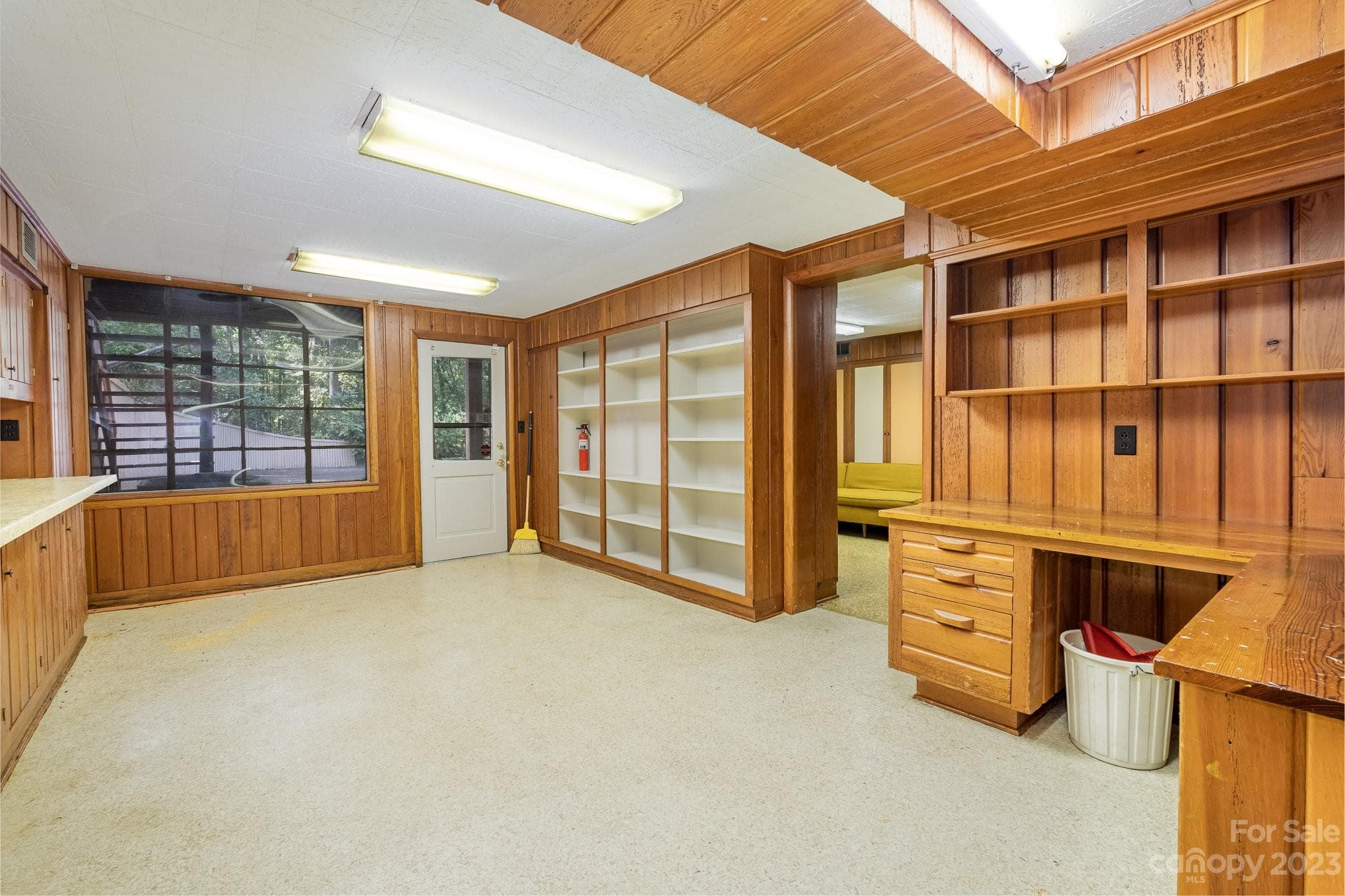 Basement, storage, shelving also shows windows looking out to side yard/ deck area. - 2756 Peachtree Road, Statesville