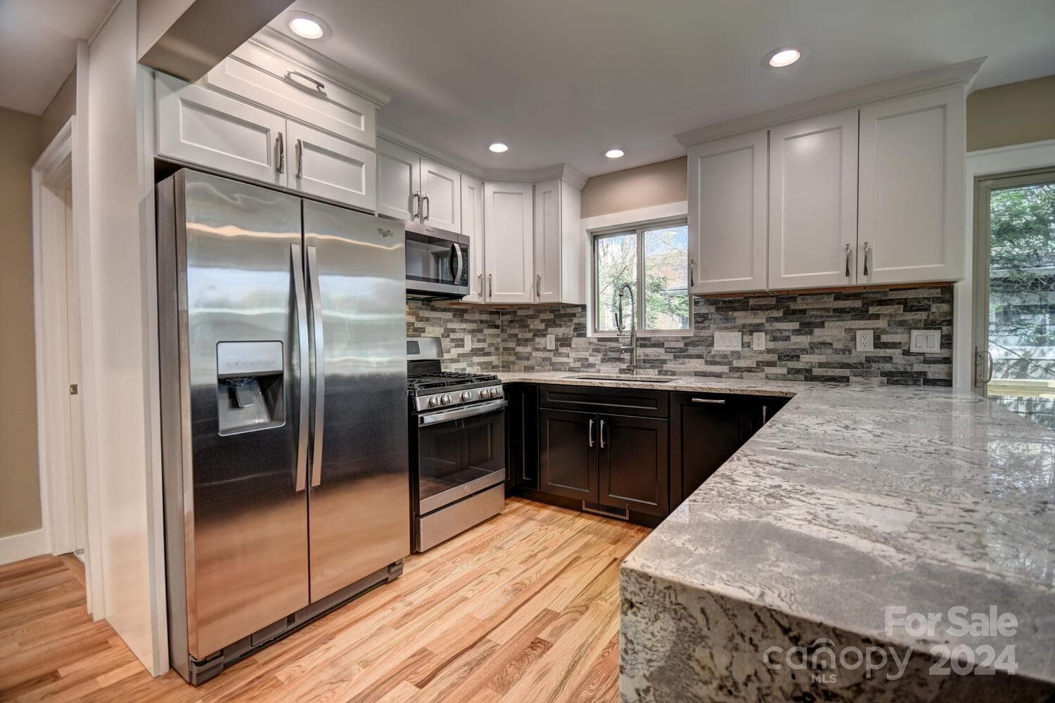Kitchen - Gas Range and Side by Side Refrigerator/Freezer - Microwave Range Hood Vented to the Outside - Woodlands Village, Maggie Valley