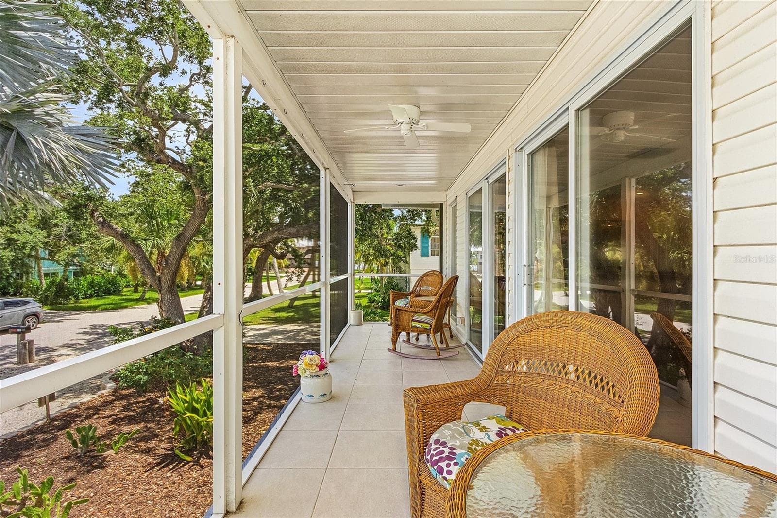 Screened porch off living room - 140 BAY MAR DR, FORT MYERS BEACH