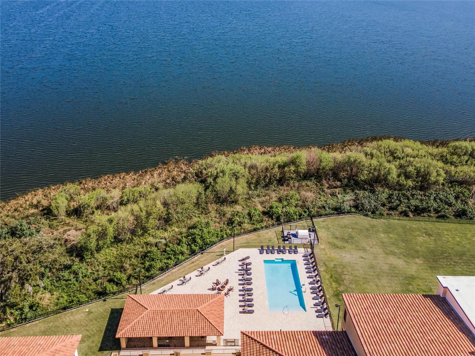 Ariel of the pool and cabana area overlooking the lake. - 16300 COUNTY ROAD 455 #305, MONTVERDE