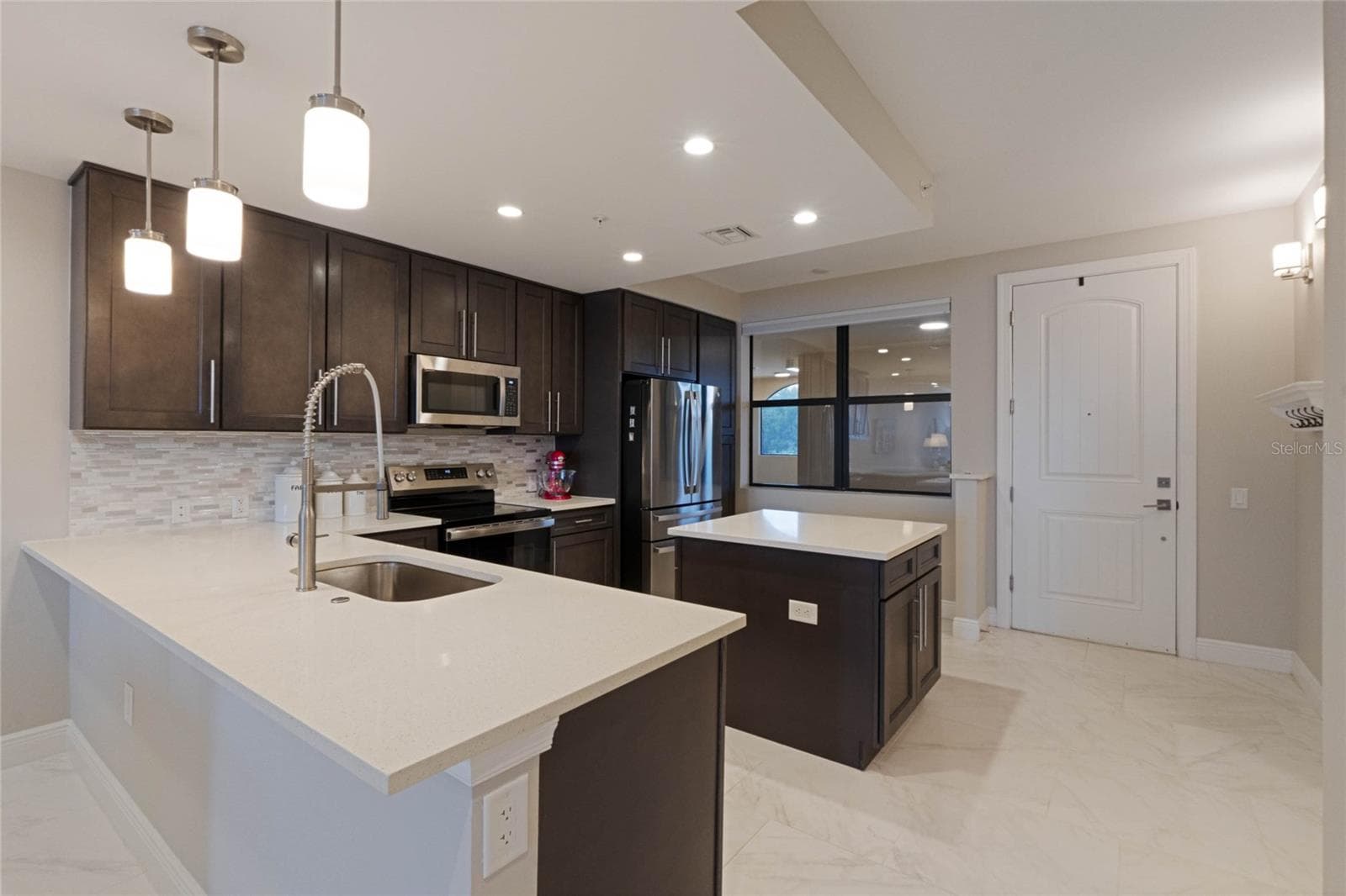 Spacious kitchen with large center island and new appliances. - 16300 COUNTY ROAD 455 #305, MONTVERDE