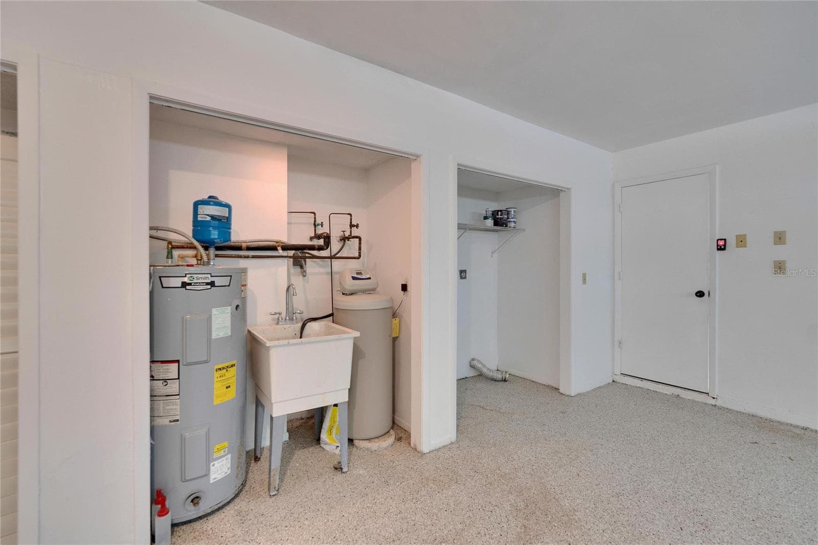 Hot water heater & area for Washer & Dryer - 370 S WOODLANDS DR, OLDSMAR
