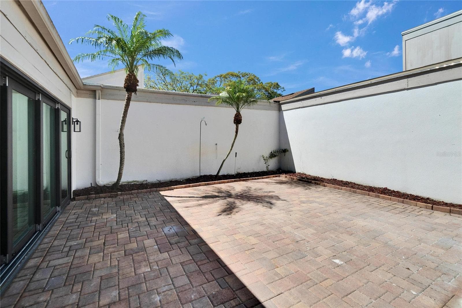 Outdoor Patio w/Brick pavers & Privacy wall - 370 S WOODLANDS DR, OLDSMAR