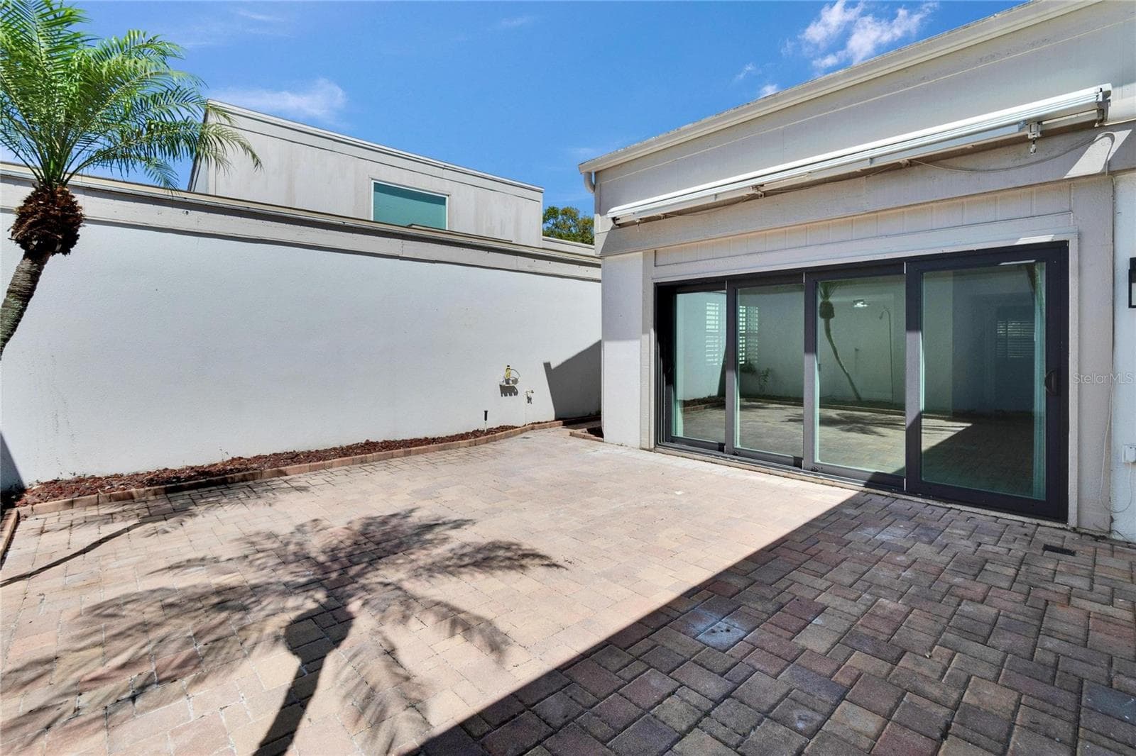 Patio with Electric retractable Awning - 370 S WOODLANDS DR, OLDSMAR