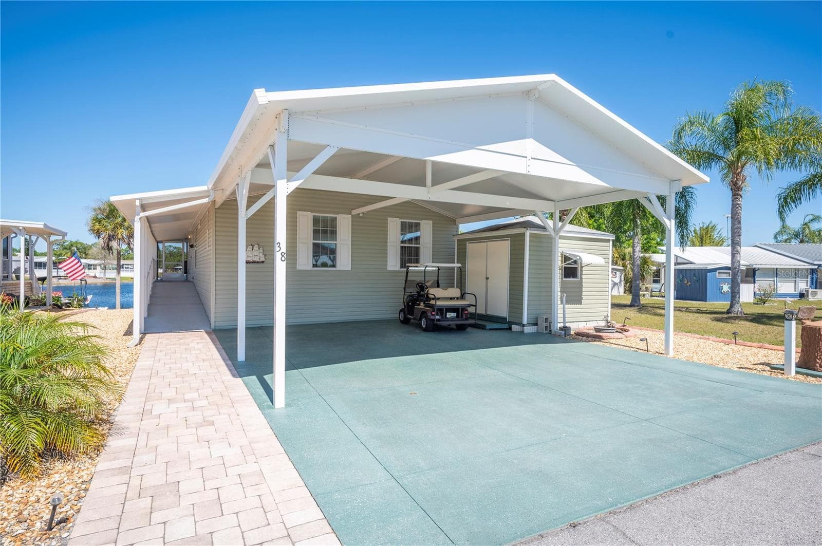 Your oversized driveway, with ample parking and ZERO yard maintenance!! - 38 QUEEN OF WATERS ST, LAKE WALES
