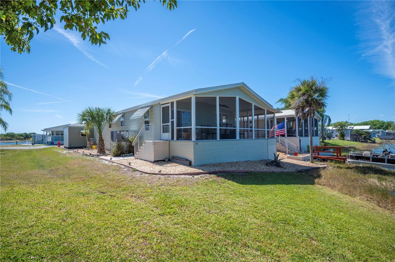 View of the back of your new home, including your expansive screened patio! - 38 QUEEN OF WATERS ST, LAKE WALES