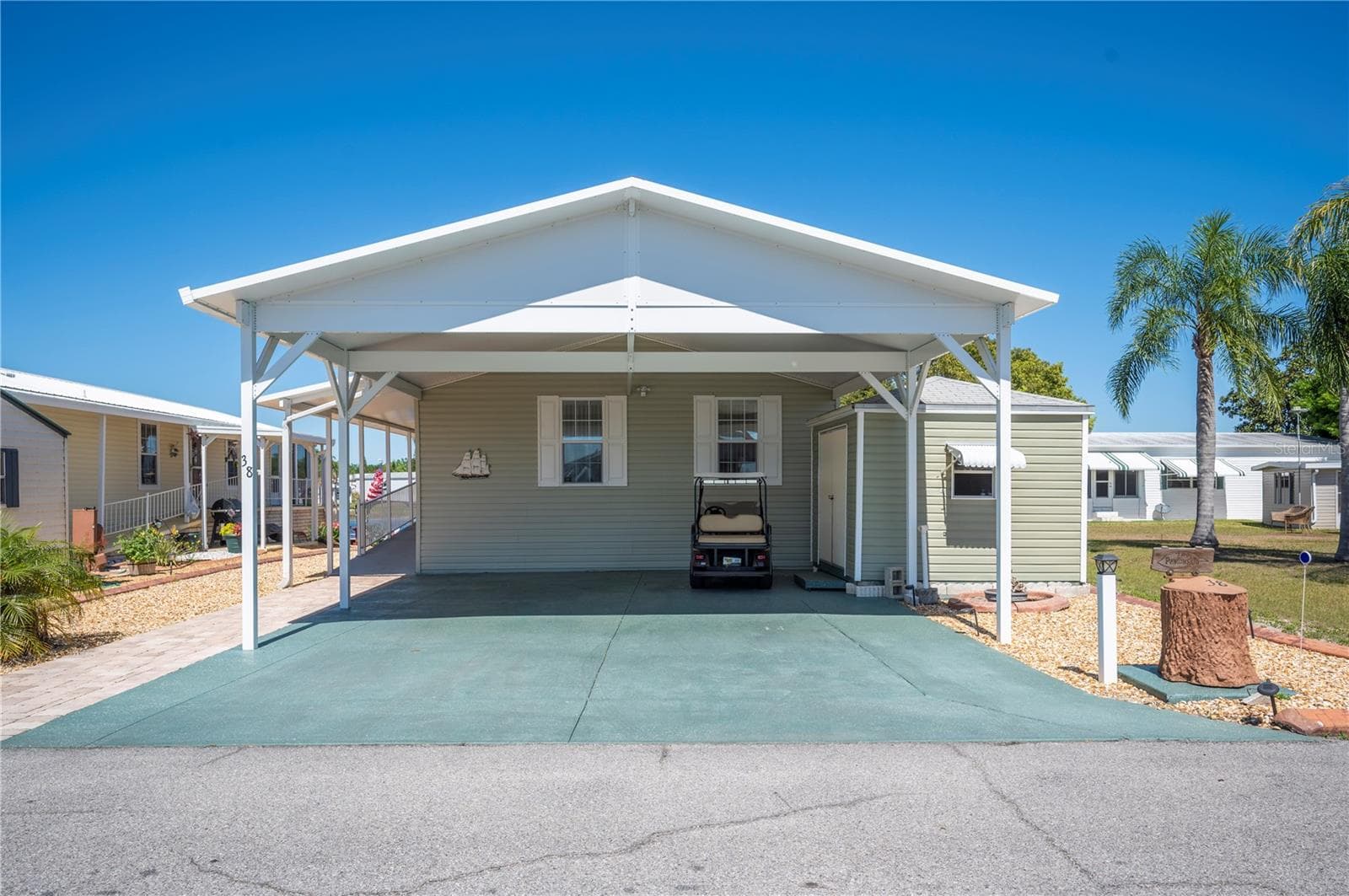Oversized carport with shed large enough to store a golf cart! - 38 QUEEN OF WATERS ST, LAKE WALES