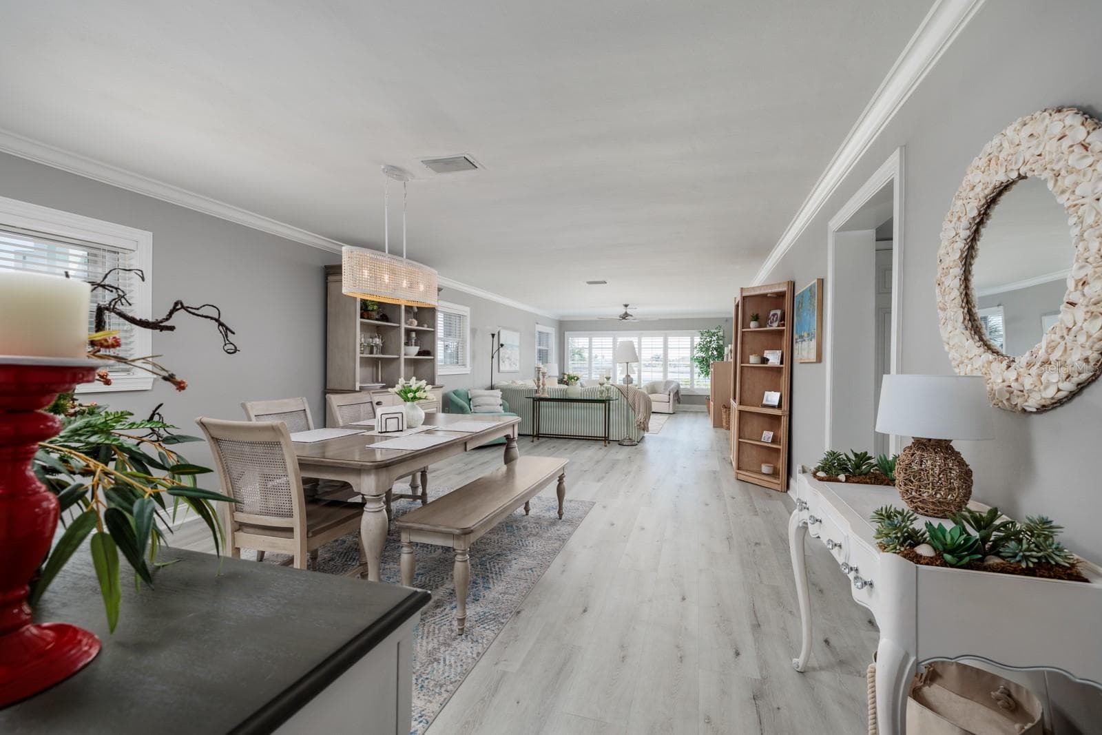 Great Room (15'x41'). Luxury vinyl plank flooring. Crown molding. Sold turnkey. - 6161 GULF WINDS DR #338, ST PETE BEACH