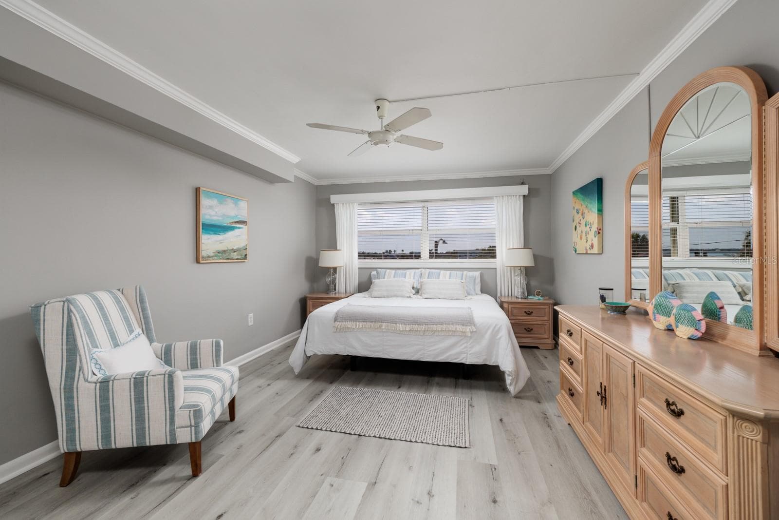 Primary bedroom (12'x16') w/En-suite bath. Crown molding. Window w/Hurricane shutter. Split bedrooms on opposite ends of condo. - 6161 GULF WINDS DR #338, ST PETE BEACH