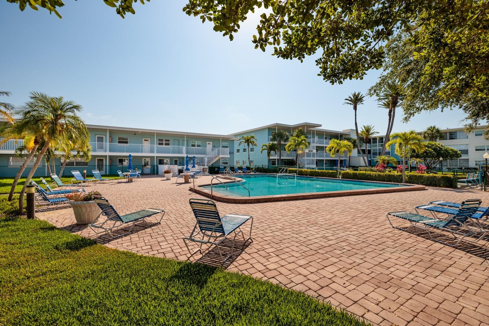 South pool (not heated) by the pier. Grilling area next to pool. - 6161 GULF WINDS DR #338, ST PETE BEACH