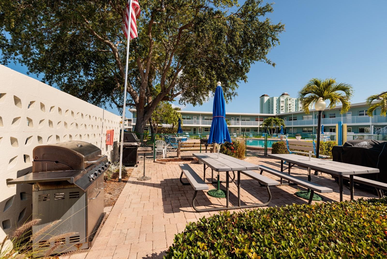 Grilling area next to the south pool by the pier. - 6161 GULF WINDS DR #338, ST PETE BEACH