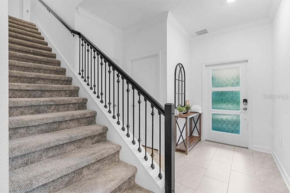 Entry way and elegant stair case - 1148 KINGSBARN ST, DAVENPORT