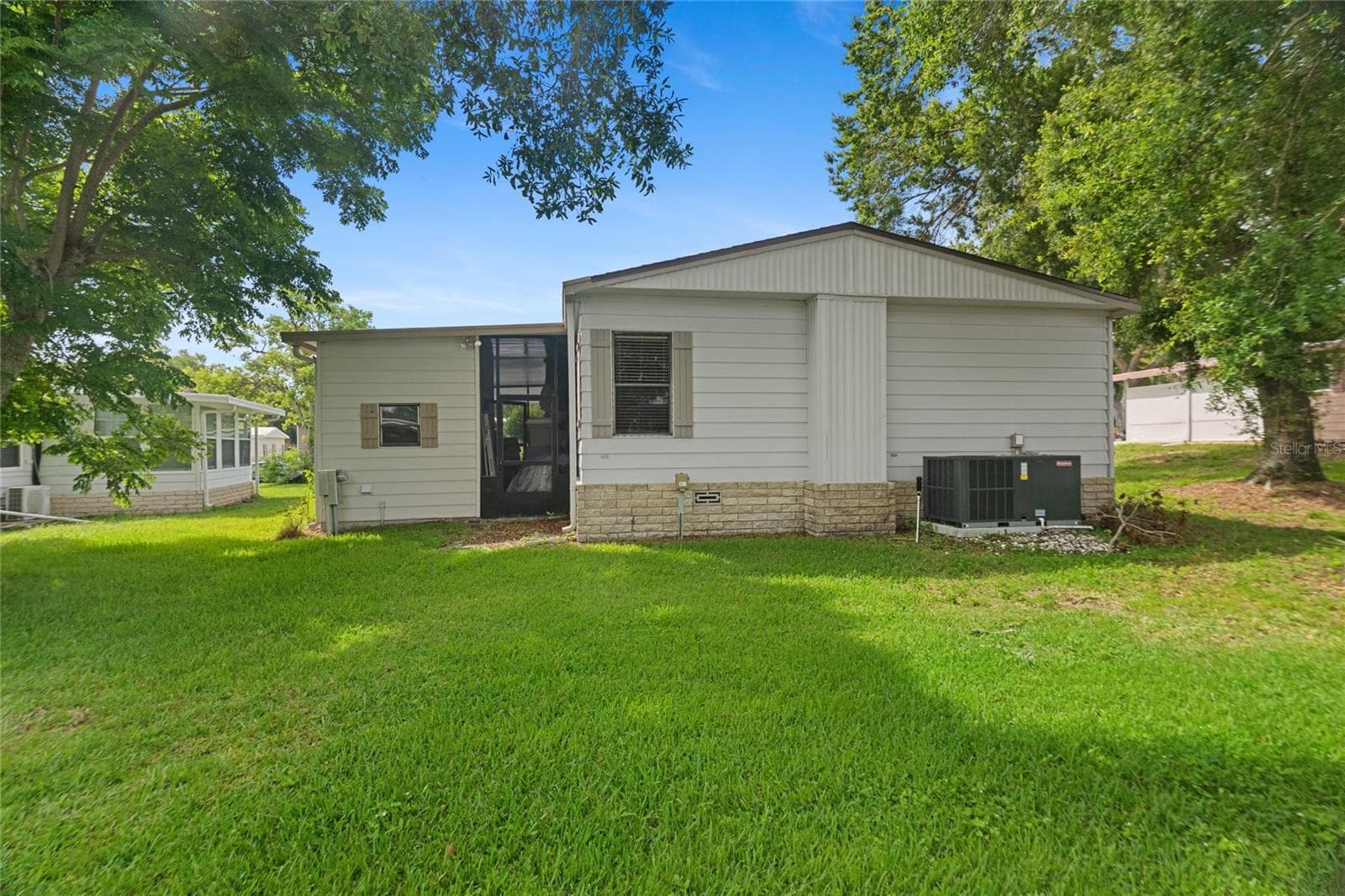 Rear of home, laundry room, new AC! - 2002 S CITRUS CIR #1728, ZELLWOOD