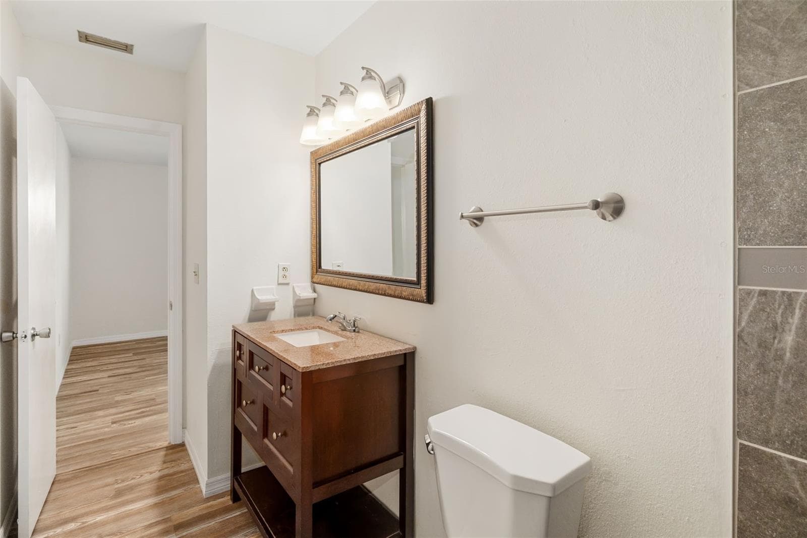 Bathroom VanityClean and functional bathroom vanity with storage and updated fixtures. - 2513 AVENUE B #B, BRADENTON BEACH