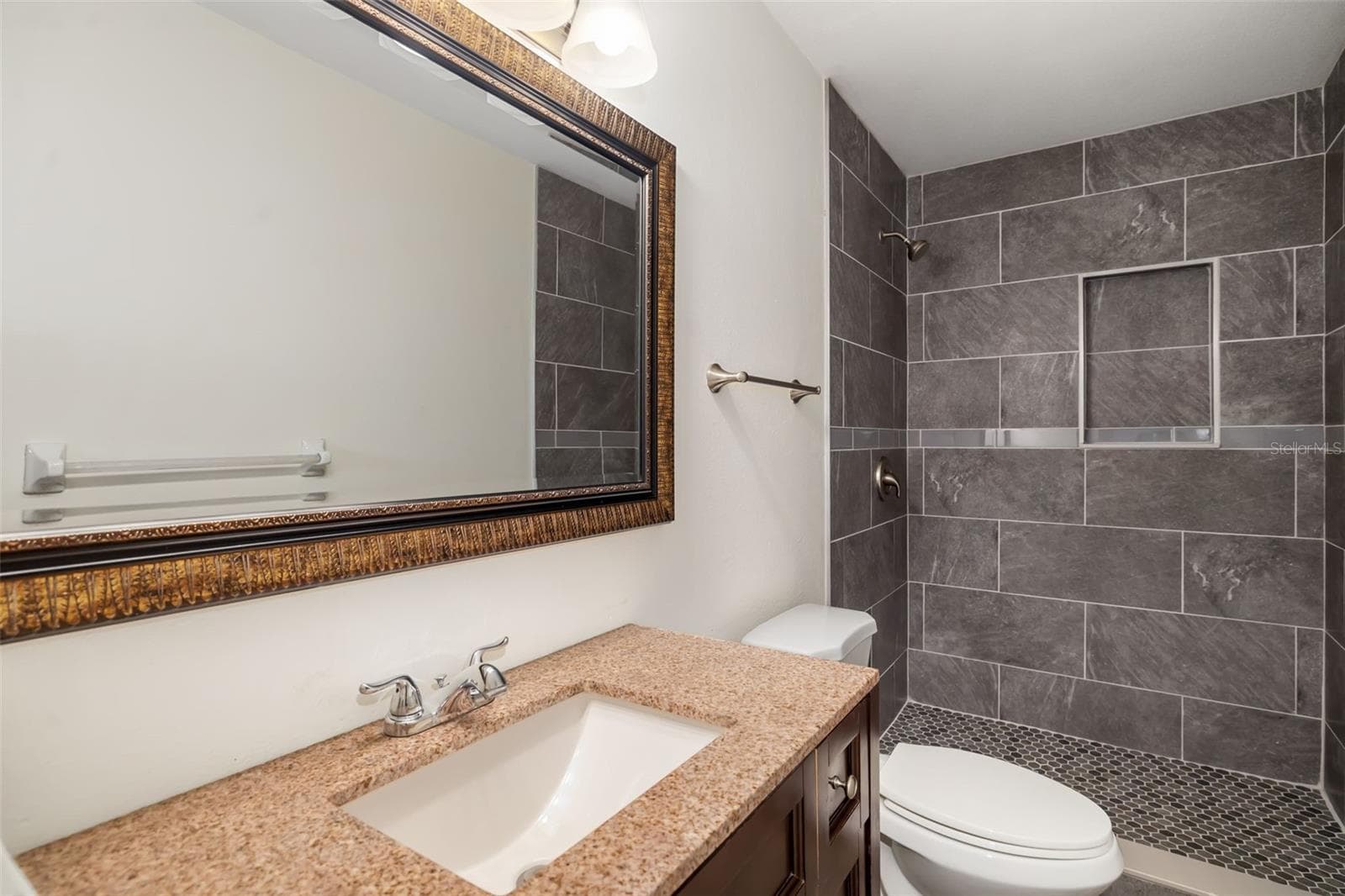 Bedroom to Bath ViewBedroom with easy access to updated bathroom and closet storage. - 2513 AVENUE B #B, BRADENTON BEACH