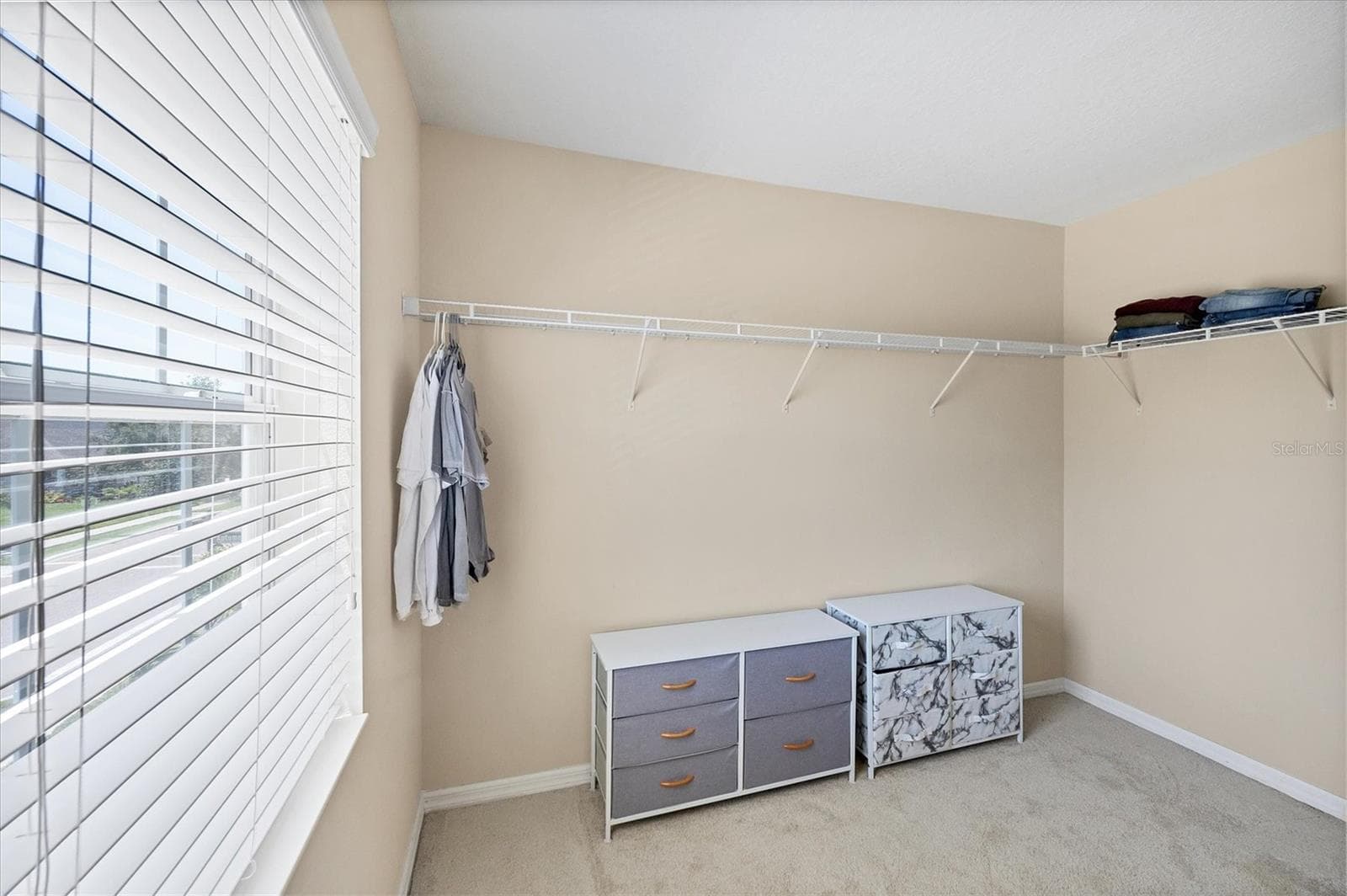 Primary suite walk in closet - 4811 WOODBROOK DR, SARASOTA